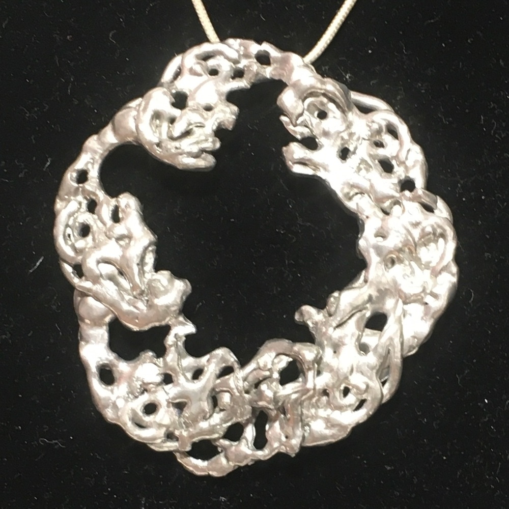Round Circle Pendant with Holes necklace by Joanne Cooper and created in 1980's